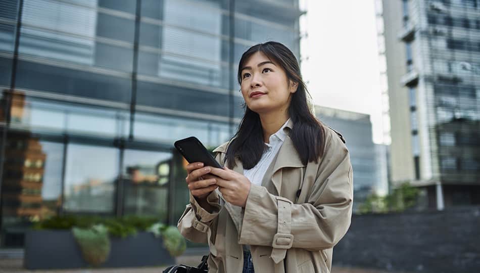 Woman on phone outside the office